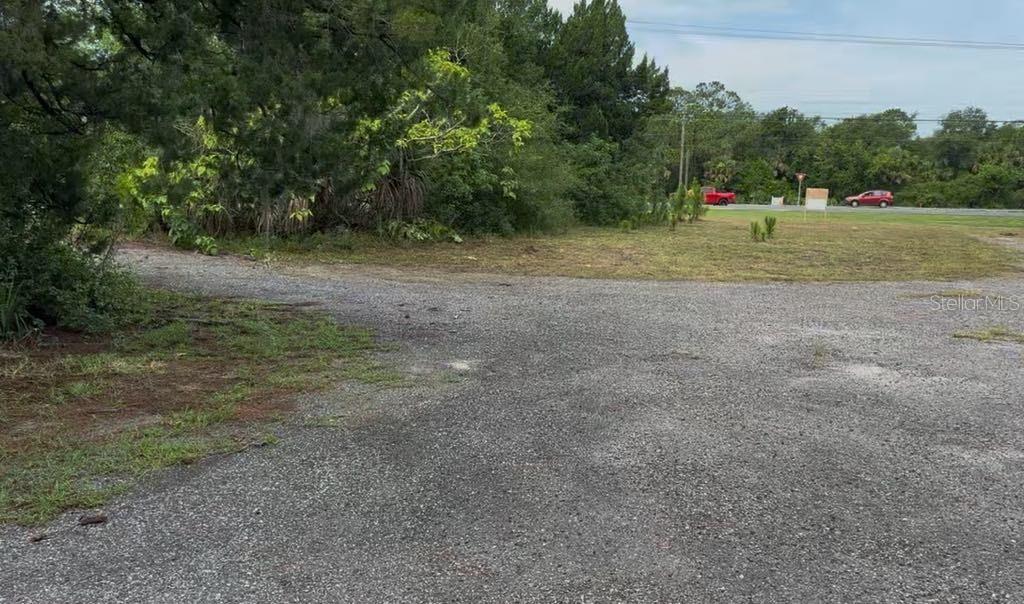 3493 South Ridgewood Avenue Edgewater, FL 32141 - Photo 2 of 4 a view of basketball area with large trees