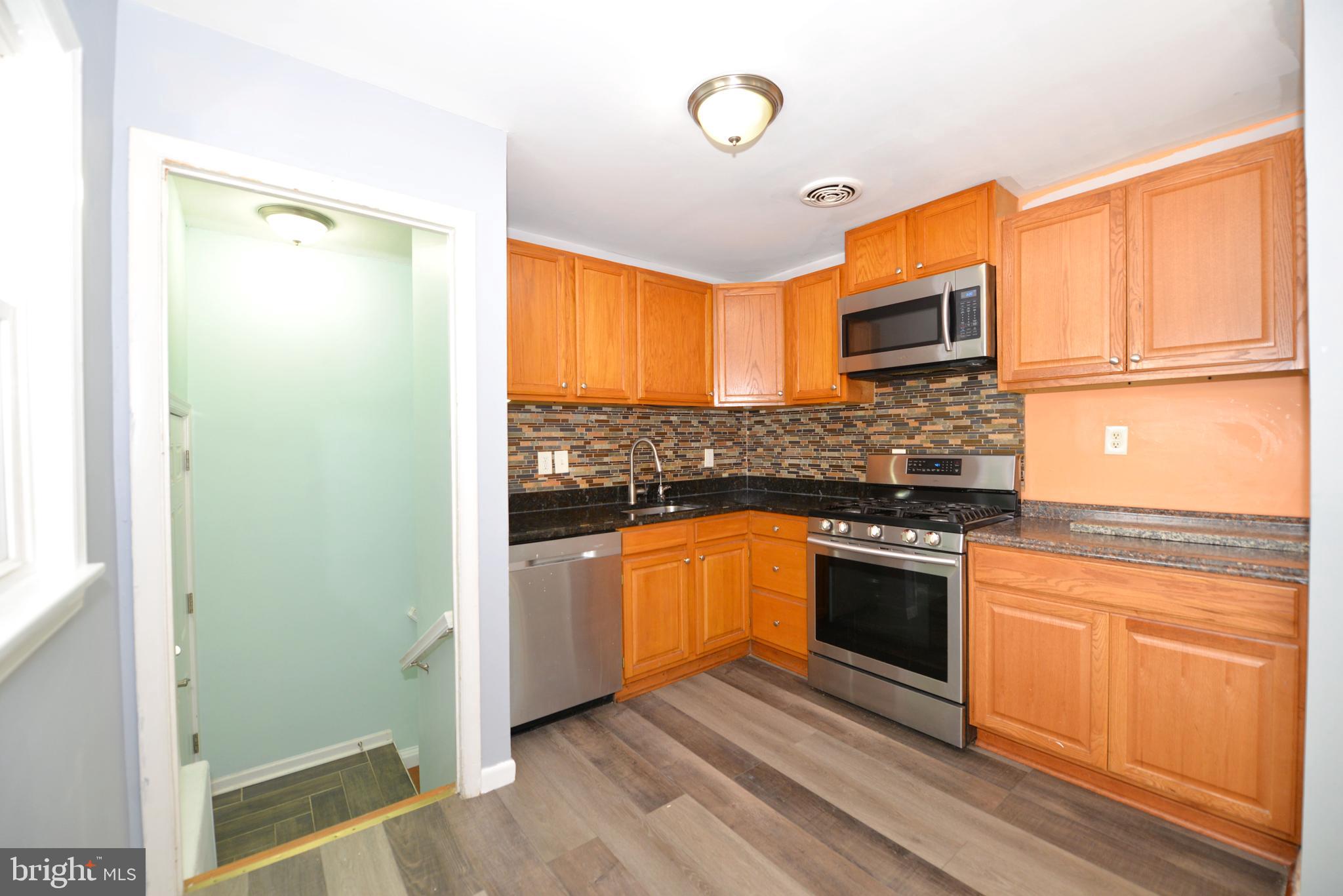 Galley kitchen with Stainless steel appliances
