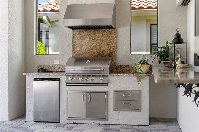 a kitchen with a stove and cabinets