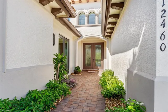 a front view of a house with garden