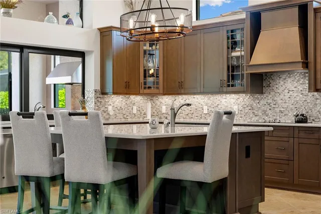 a kitchen with a sink cabinets and window