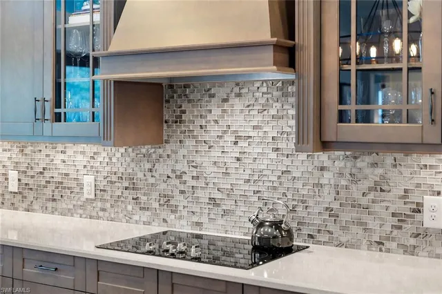 a bathroom with a stove and a shower