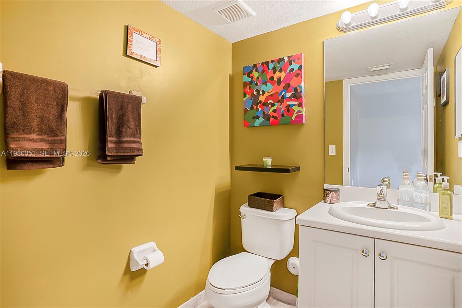 11271 Southwest 234 Terrace Homestead, FL 33032 - Photo 16 of 44 a bathroom with a toilet sink and mirror