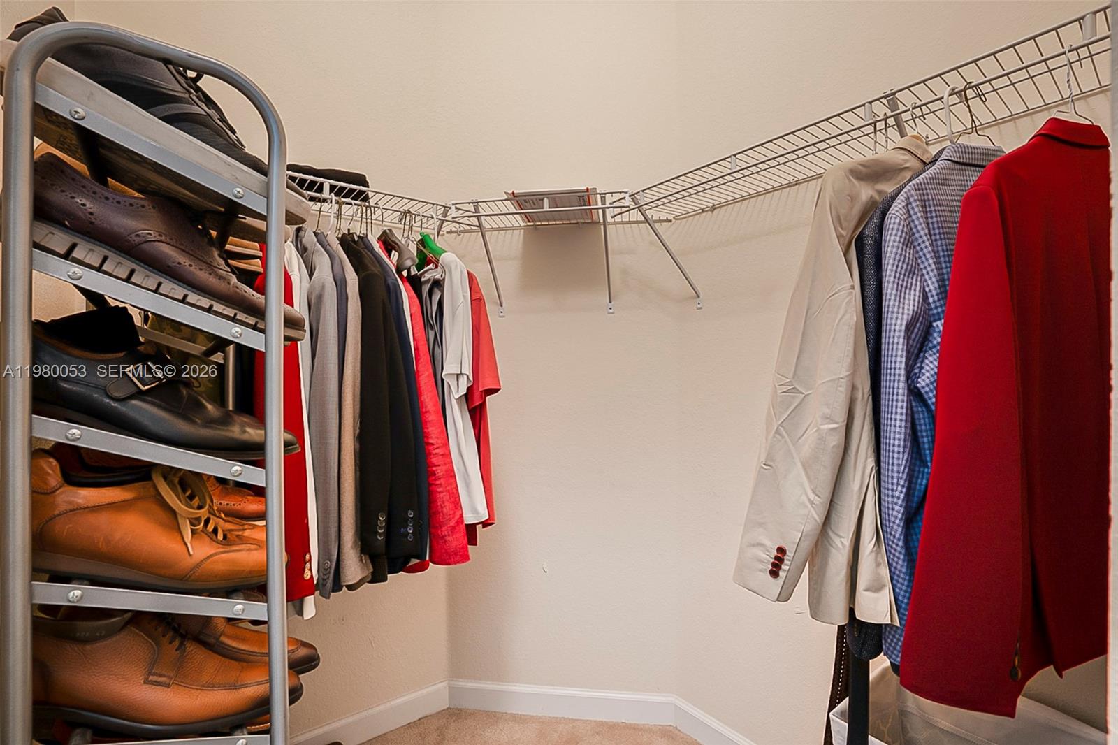 11271 Southwest 234 Terrace Homestead, FL 33032 - Photo 23 of 44 a view of walk in closet with clothes and shoes