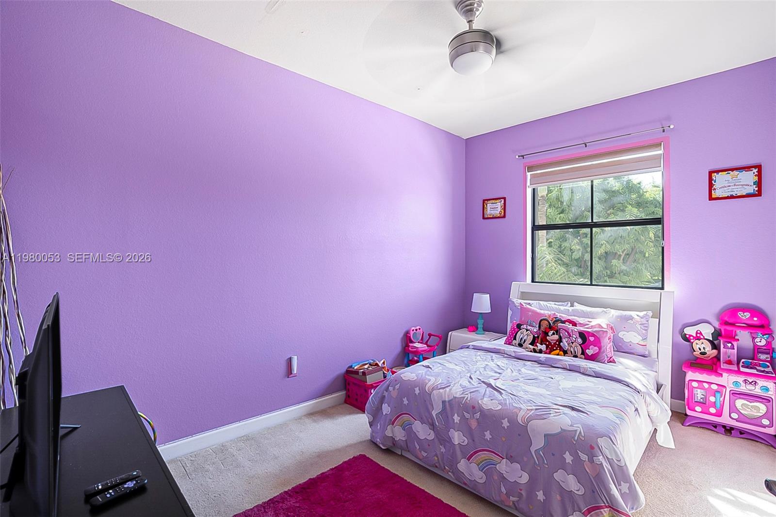 11271 Southwest 234 Terrace Homestead, FL 33032 - Photo 26 of 44 a bedroom with a bed and a window