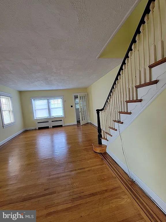 7522 North 21st Street Philadelphia, PA 19138 - Photo 3 of 26 a view of empty room with wooden floor and fan