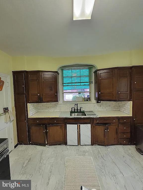 7522 North 21st Street Philadelphia, PA 19138 - Photo 6 of 26 a kitchen with a sink and cabinets