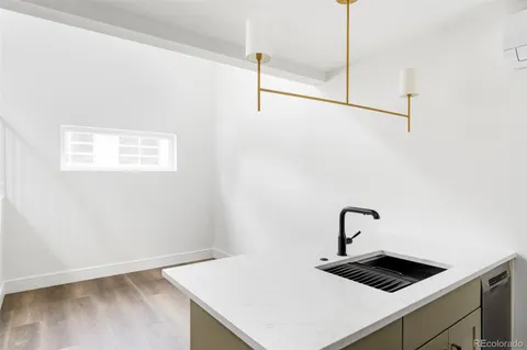 a bathroom with a sink a toilet and tub