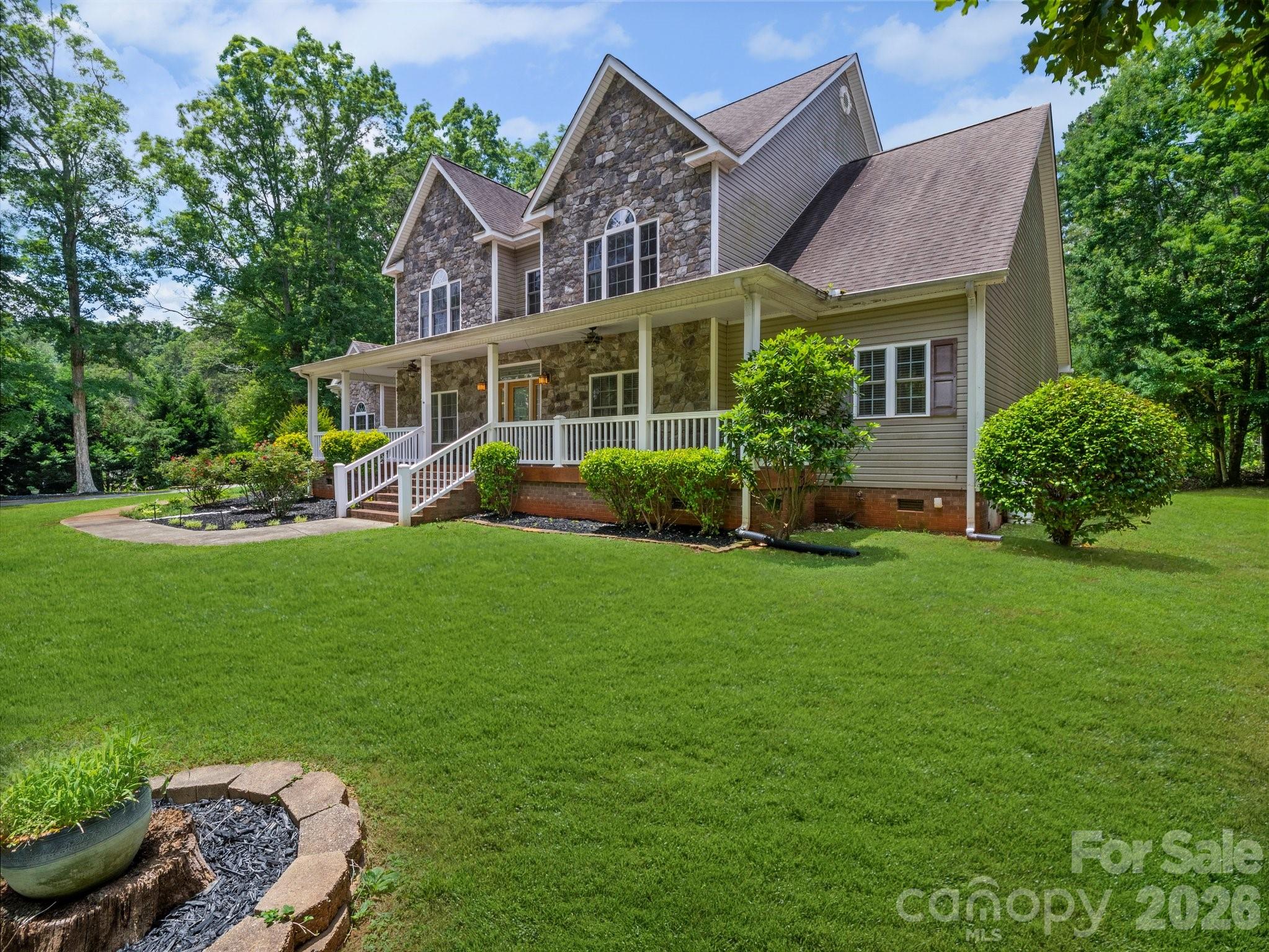217 Blossom Hill Road Lincolnton, NC 28092 - Photo 1 of 44 a view of a house with a yard and sitting area