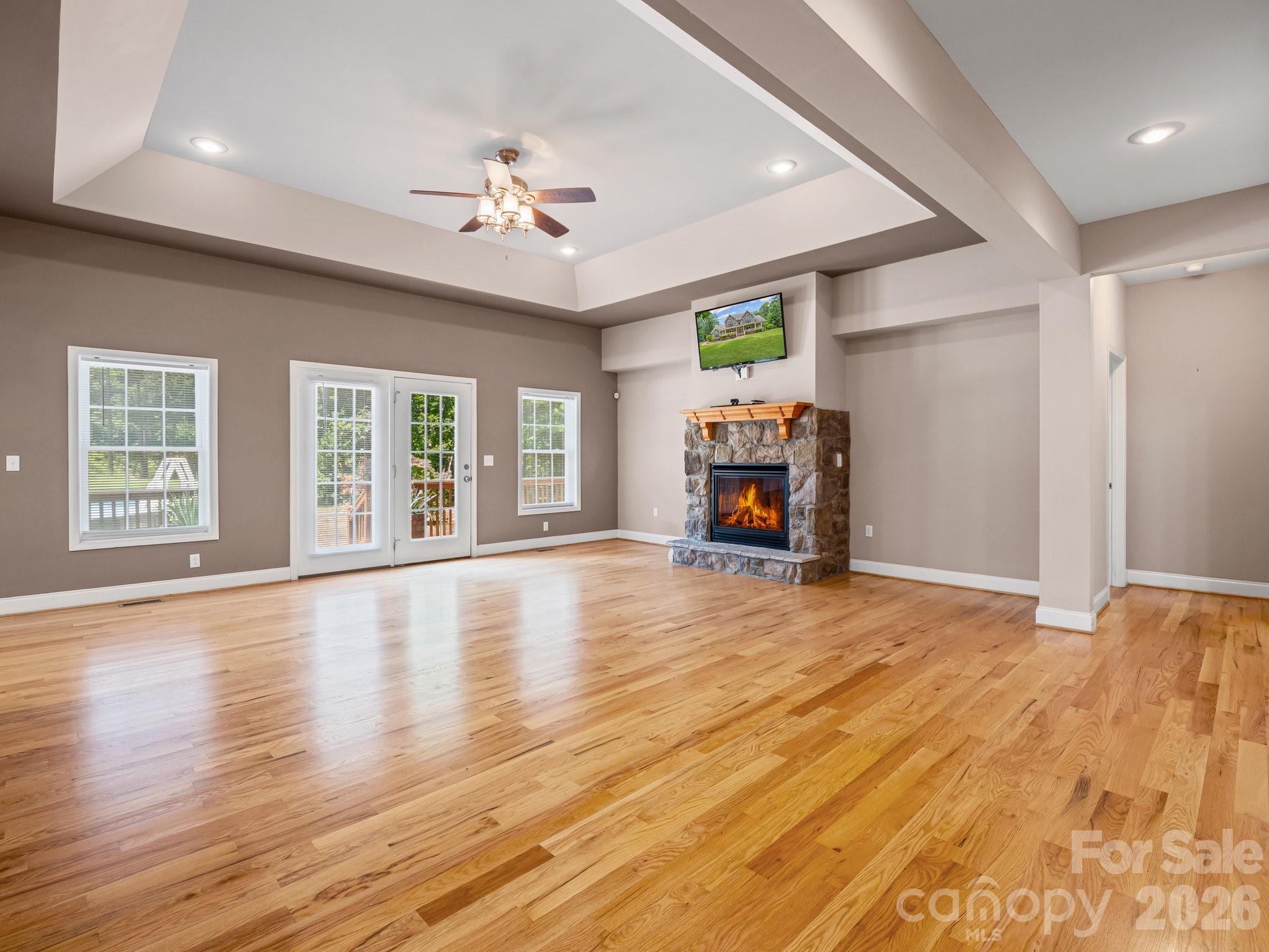 217 Blossom Hill Road Lincolnton, NC 28092 - Photo 13 of 44 a view of empty room with wooden floor and fan