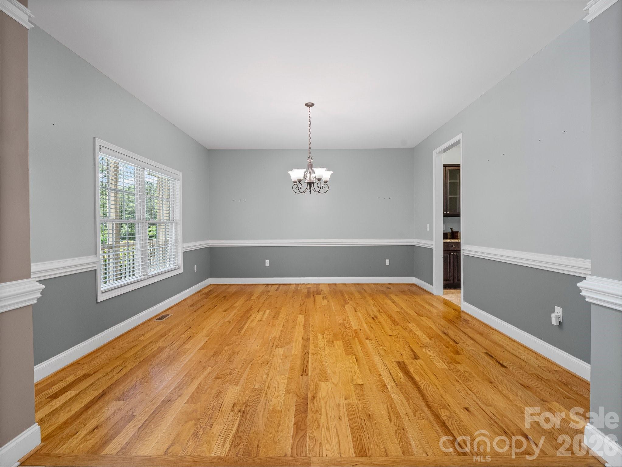 217 Blossom Hill Road Lincolnton, NC 28092 - Photo 24 of 44 a view of empty room with wooden floor and fan