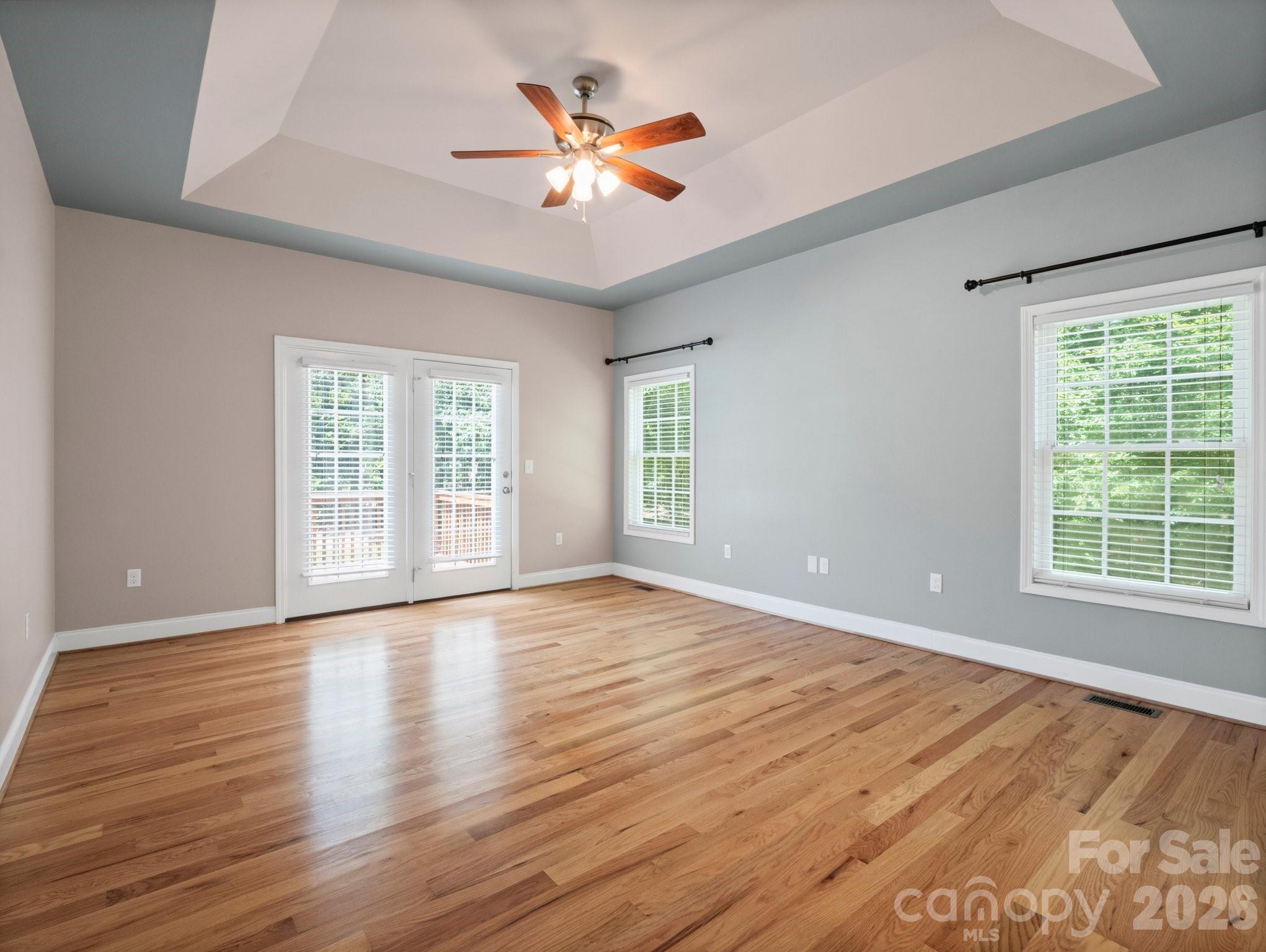217 Blossom Hill Road Lincolnton, NC 28092 - Photo 29 of 44 a view of an empty room with wooden floor and a window