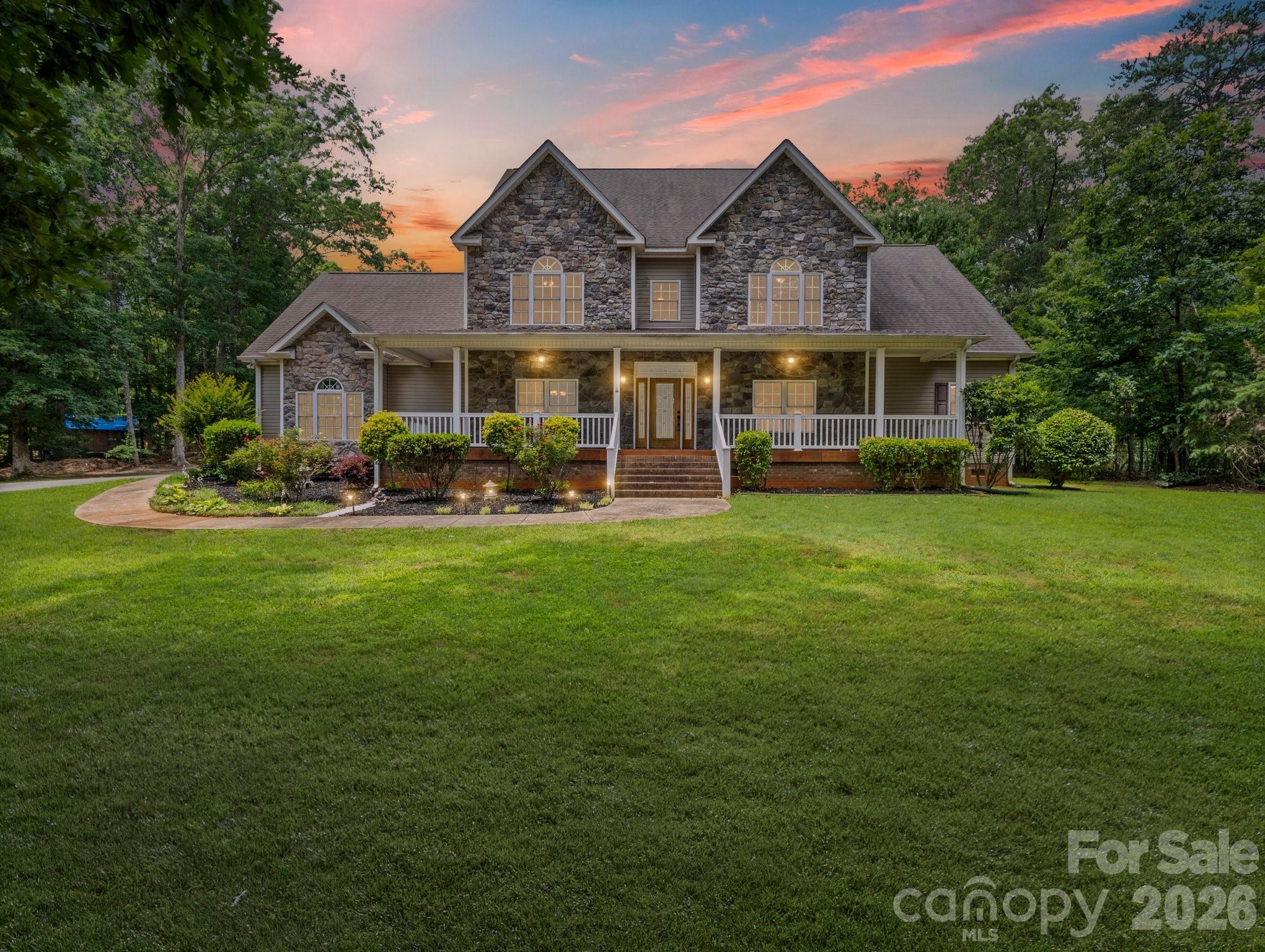 217 Blossom Hill Road Lincolnton, NC 28092 - Photo 3 of 44 a front view of a house with garden