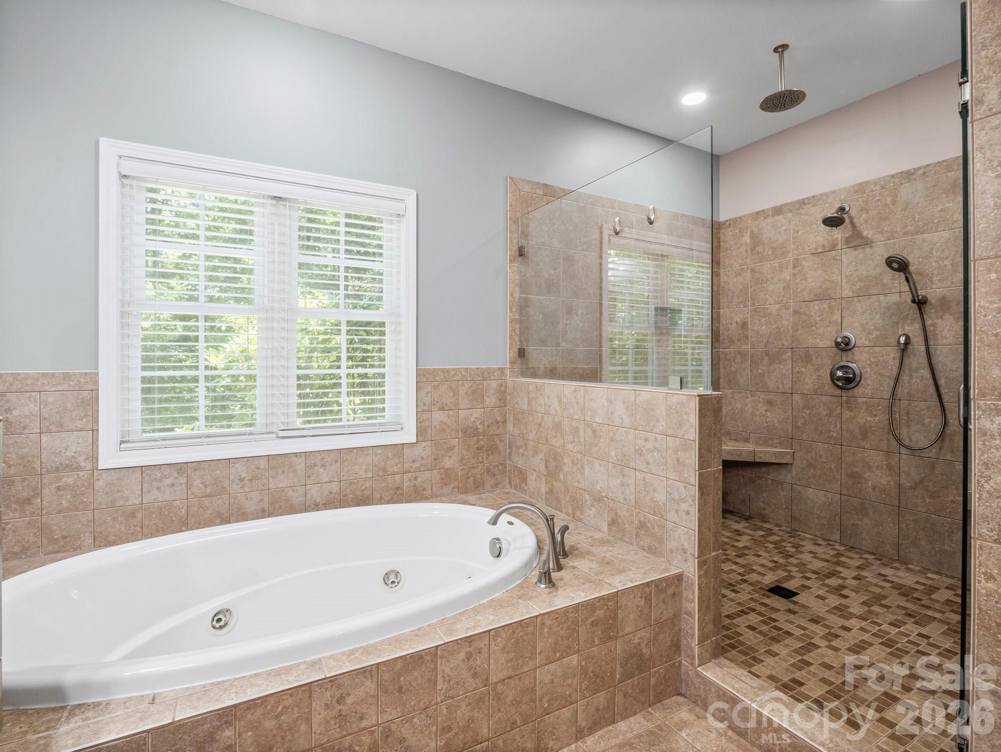 217 Blossom Hill Road Lincolnton, NC 28092 - Photo 31 of 44 a bathroom with a bathtub and a shower