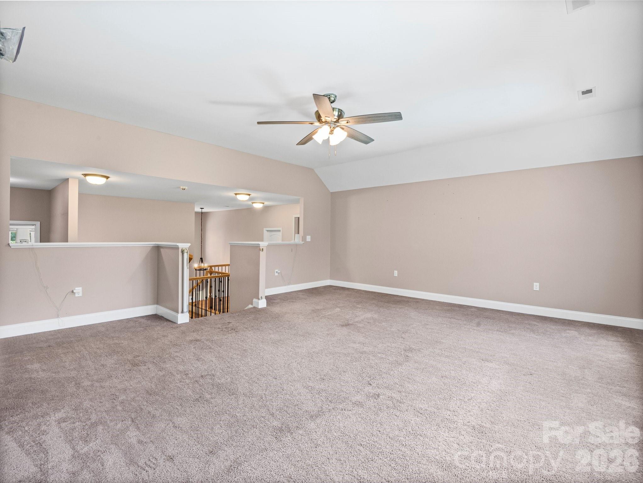 217 Blossom Hill Road Lincolnton, NC 28092 - Photo 34 of 44 an empty room with a empty space and a ceiling fan