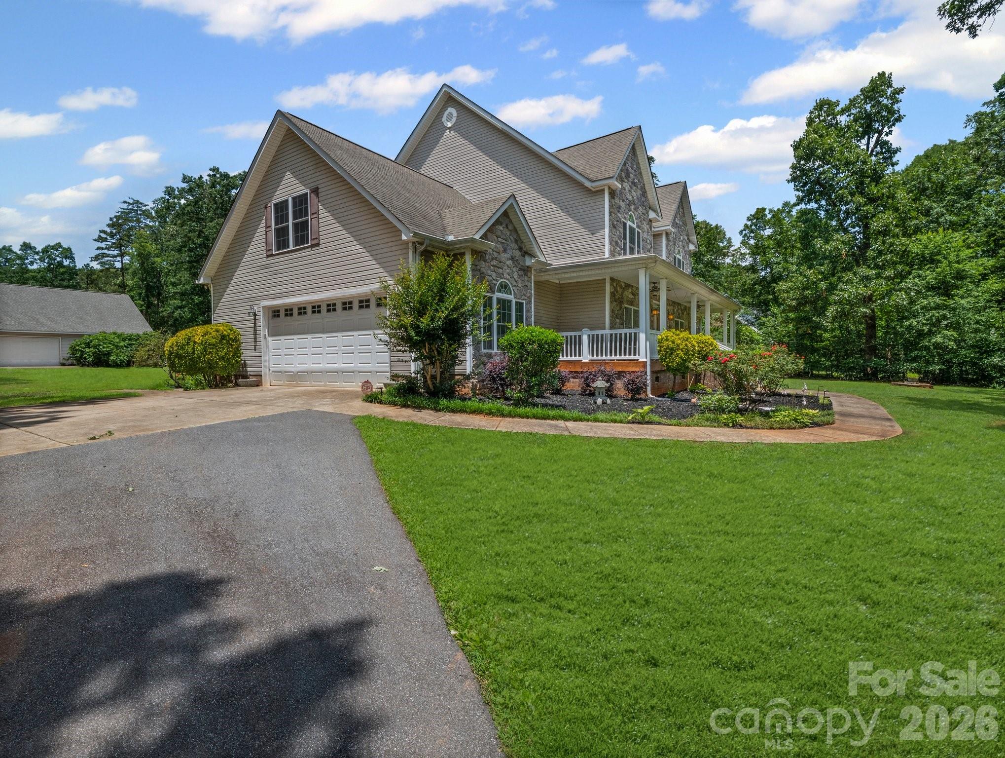 217 Blossom Hill Road Lincolnton, NC 28092 - Photo 4 of 44 a front view of a house with a yard