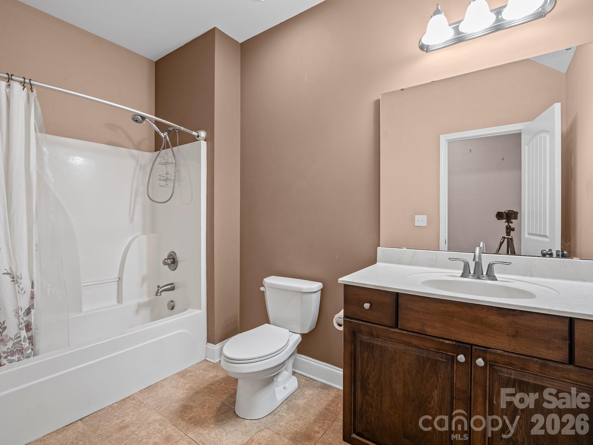 217 Blossom Hill Road Lincolnton, NC 28092 - Photo 43 of 44 a bathroom with a sink a toilet and shower