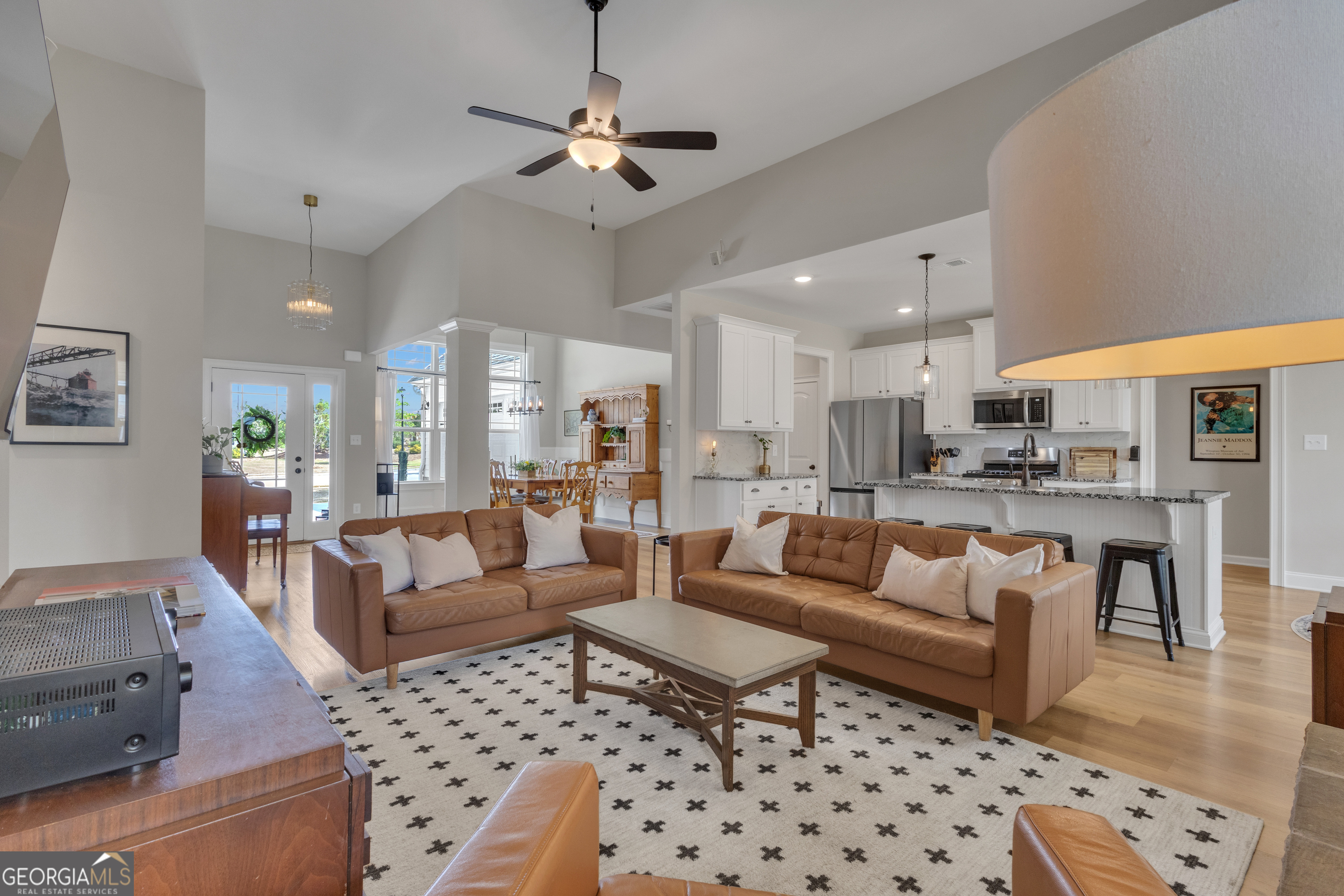 50 Cushing Street Senoia, GA 30276 - Photo 11 of 72 a living room with furniture kitchen view and a chandelier