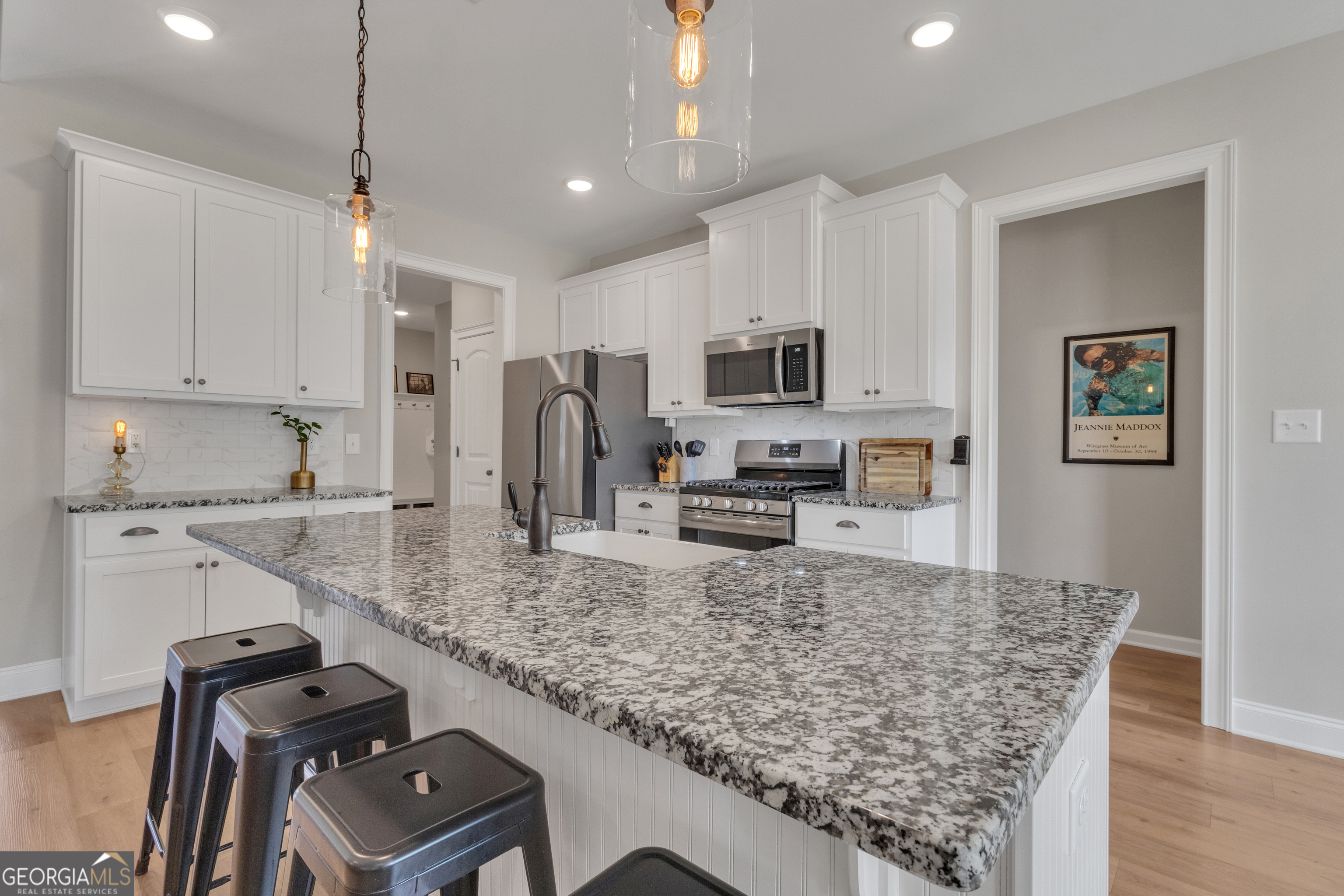50 Cushing Street Senoia, GA 30276 - Photo 12 of 72 a kitchen with kitchen island granite countertop a sink appliances and cabinets