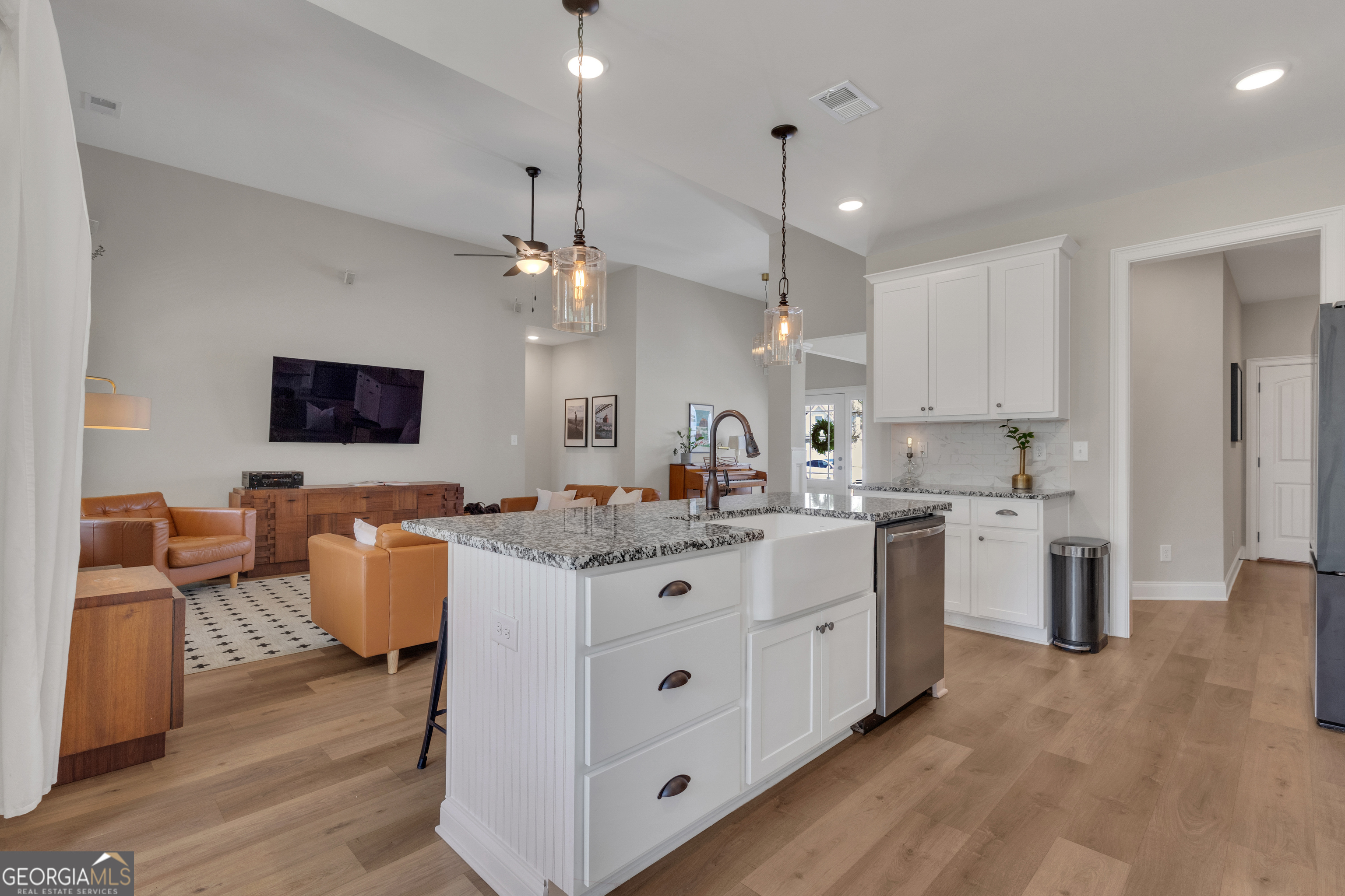 50 Cushing Street Senoia, GA 30276 - Photo 16 of 72 a large white kitchen with cabinets a sink and a stove
