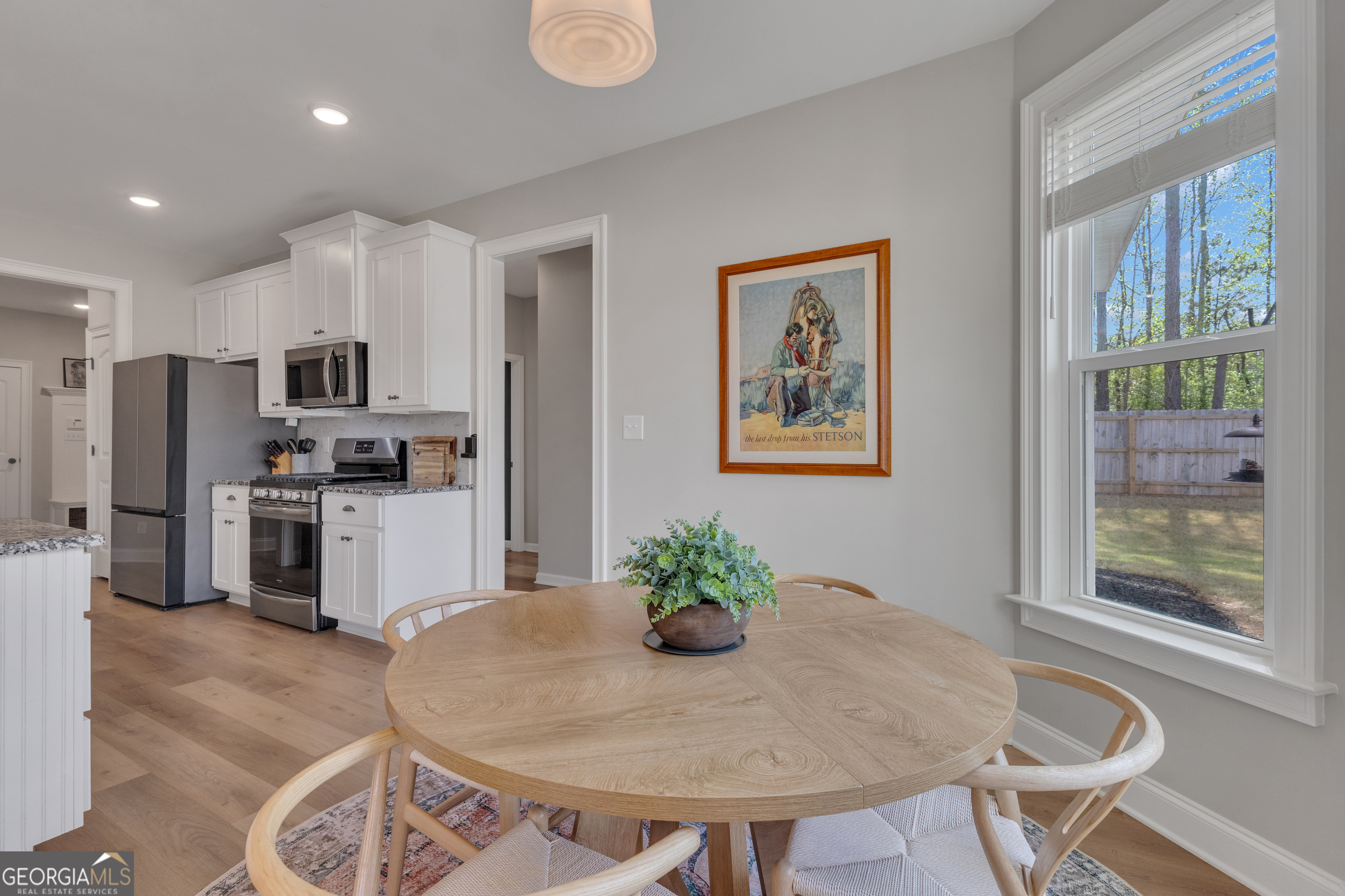 50 Cushing Street Senoia, GA 30276 - Photo 20 of 72 a kitchen with granite countertop stainless steel appliances a sink and a refrigerator