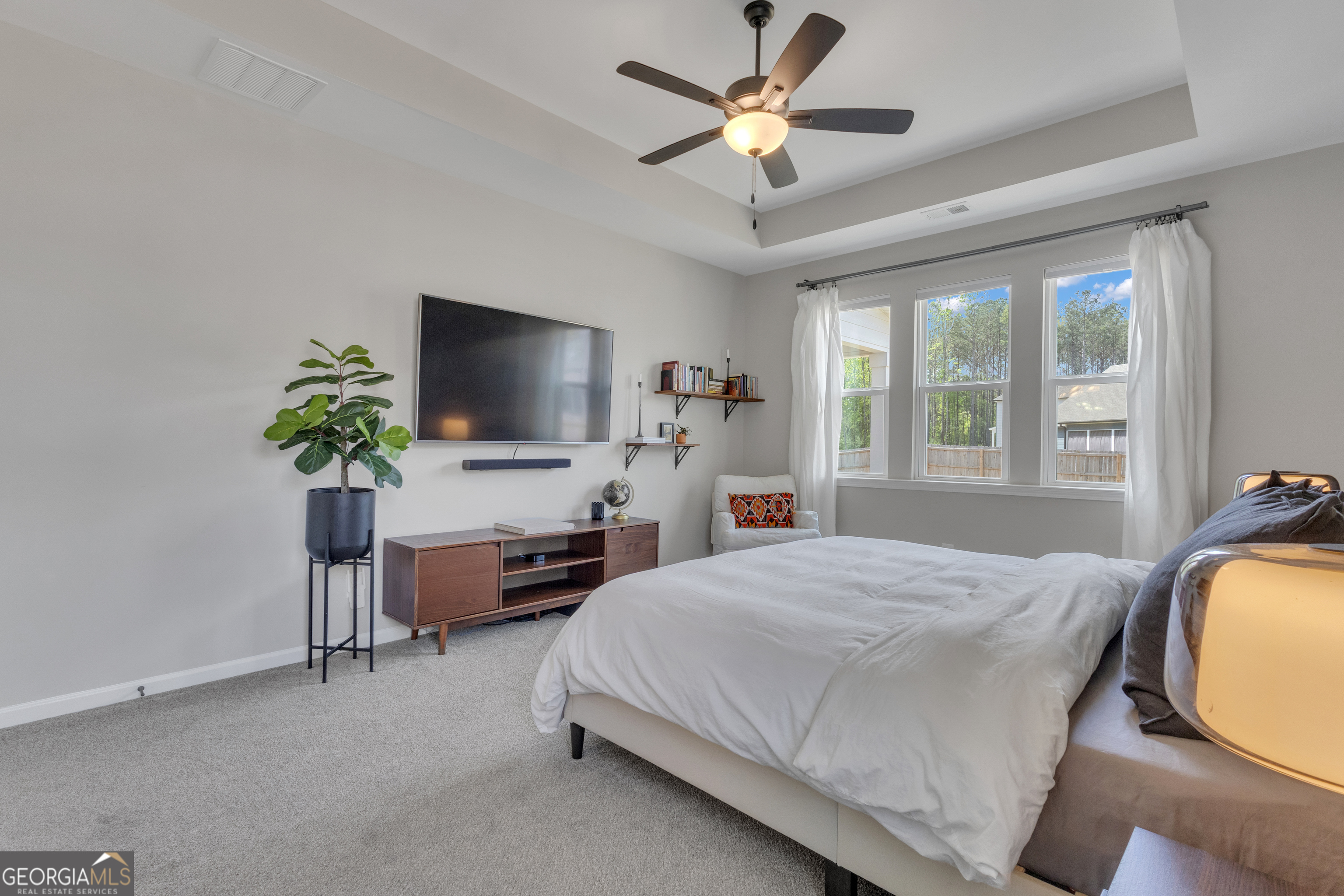 50 Cushing Street Senoia, GA 30276 - Photo 23 of 72 a bedroom with a bed and a flat screen tv