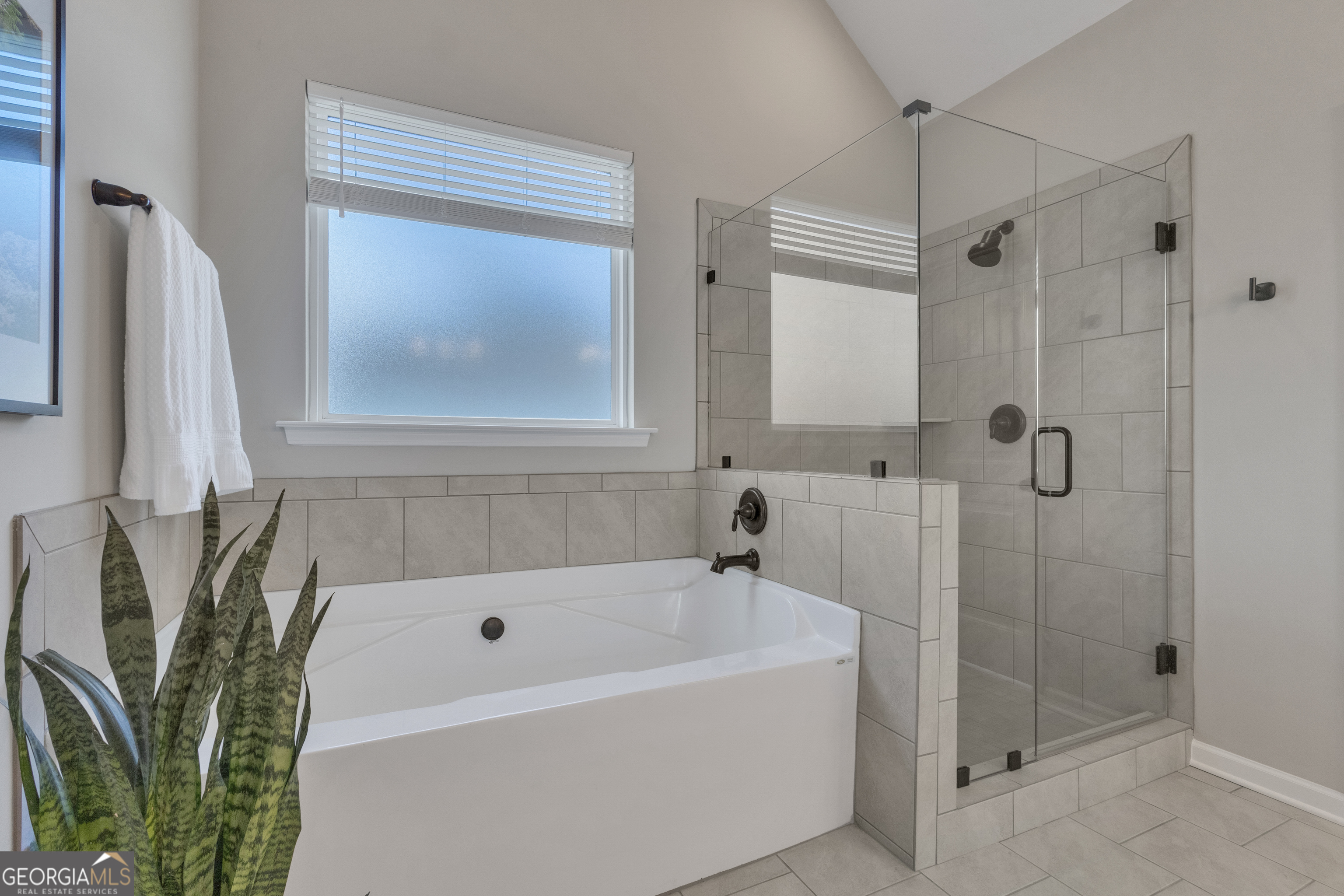 50 Cushing Street Senoia, GA 30276 - Photo 29 of 72 a bathroom with a bathtub and shower