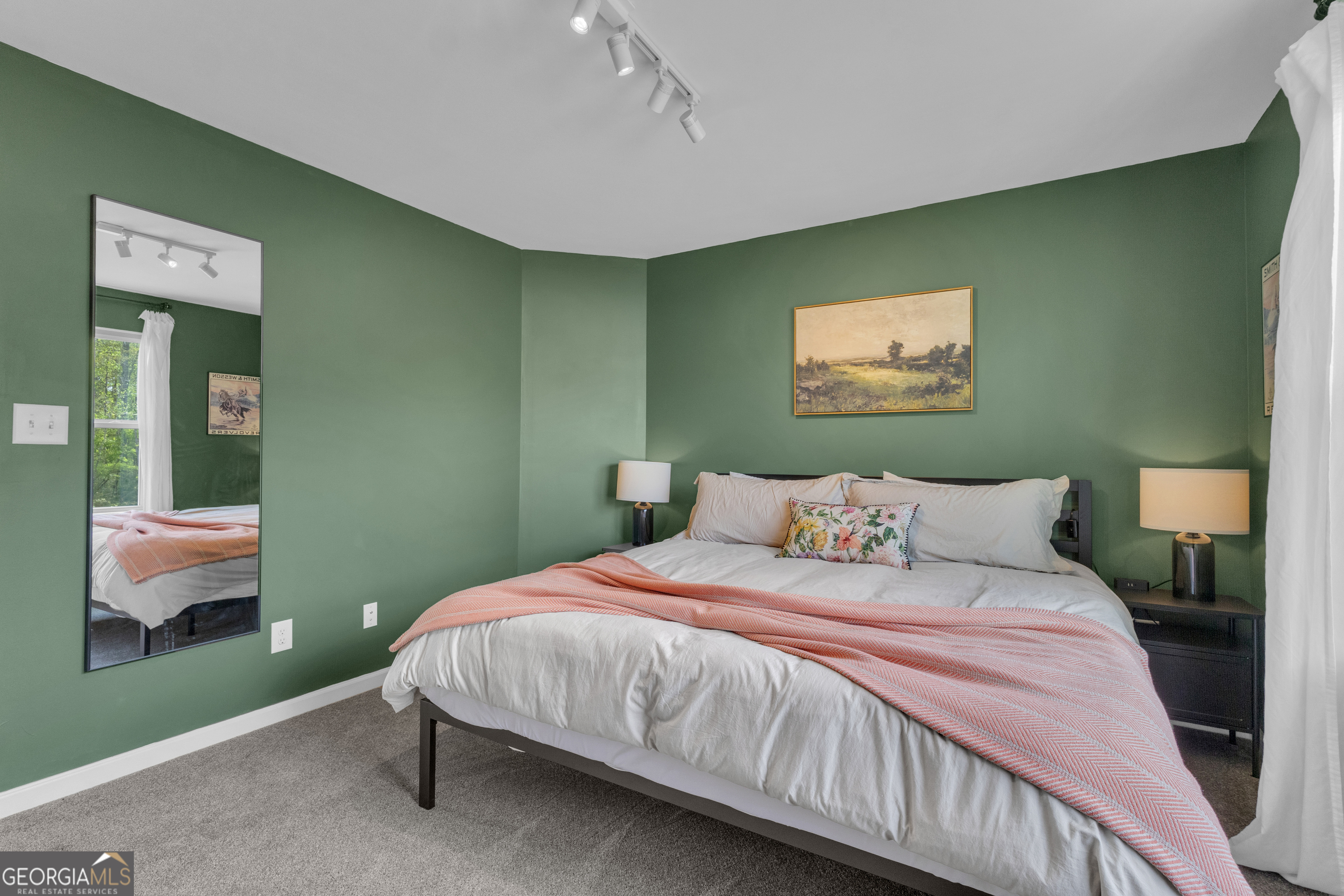 50 Cushing Street Senoia, GA 30276 - Photo 43 of 72 a bedroom with a bed and a painting on the wall