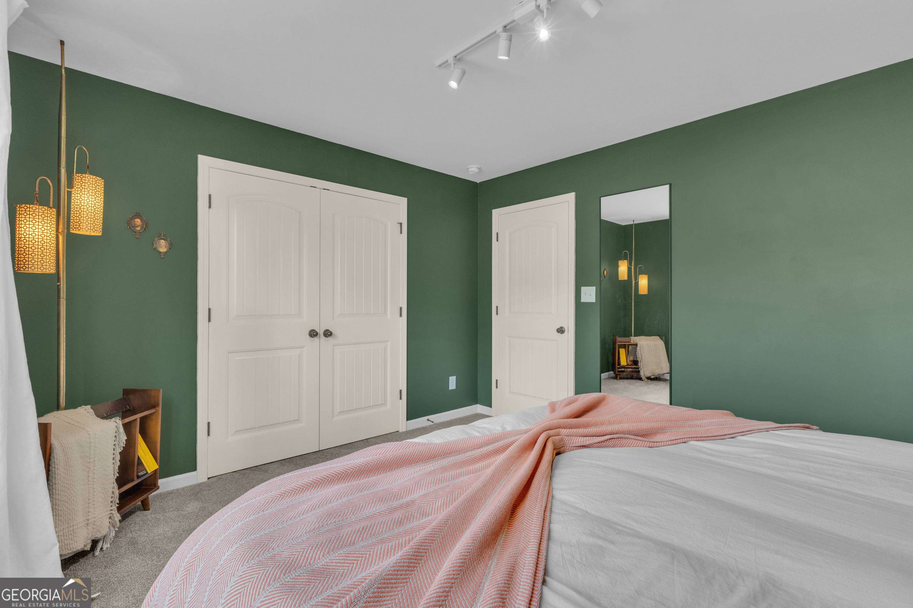 50 Cushing Street Senoia, GA 30276 - Photo 44 of 72 a bedroom with a bed and a mirror