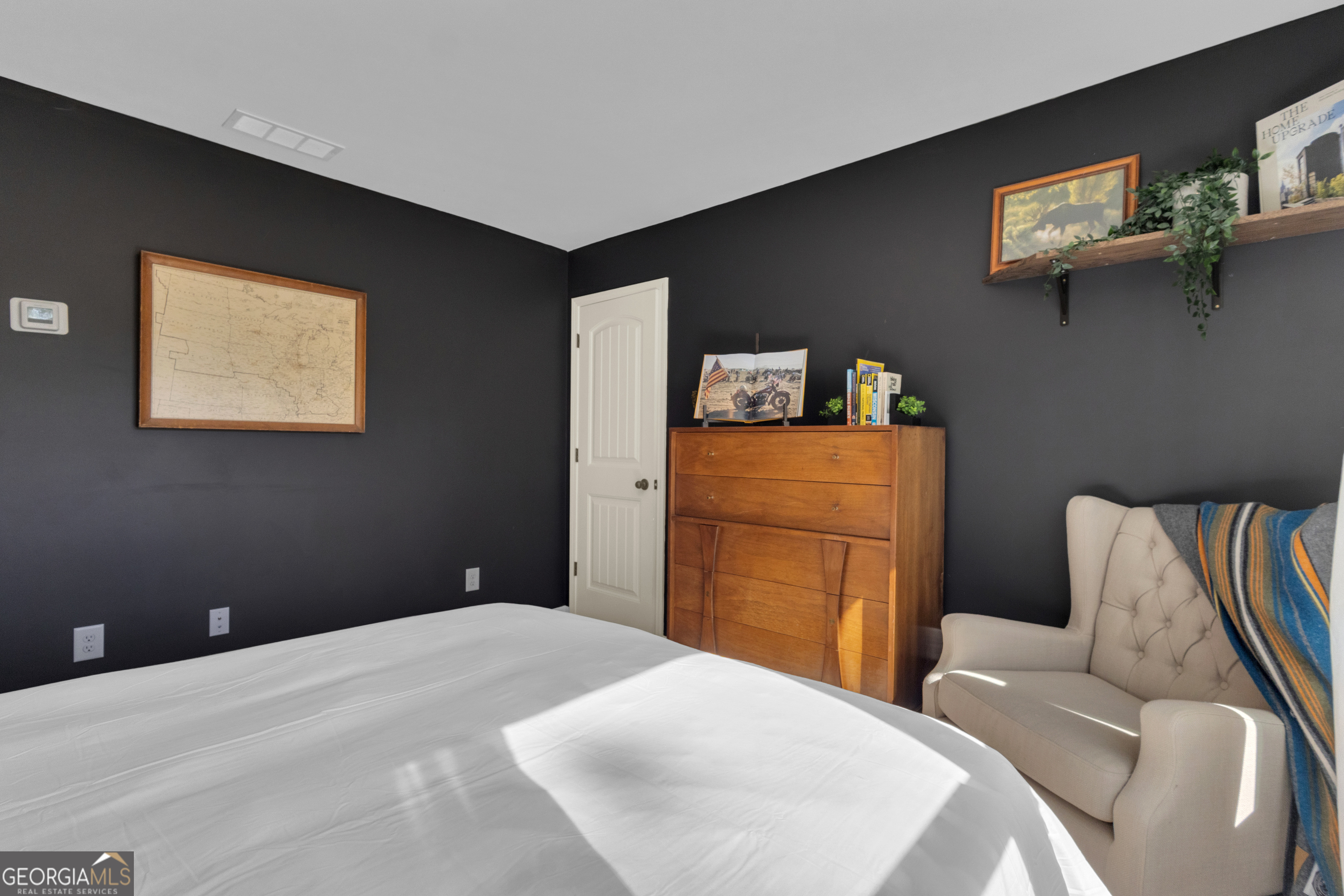 50 Cushing Street Senoia, GA 30276 - Photo 48 of 72 a bedroom with a bed and furniture