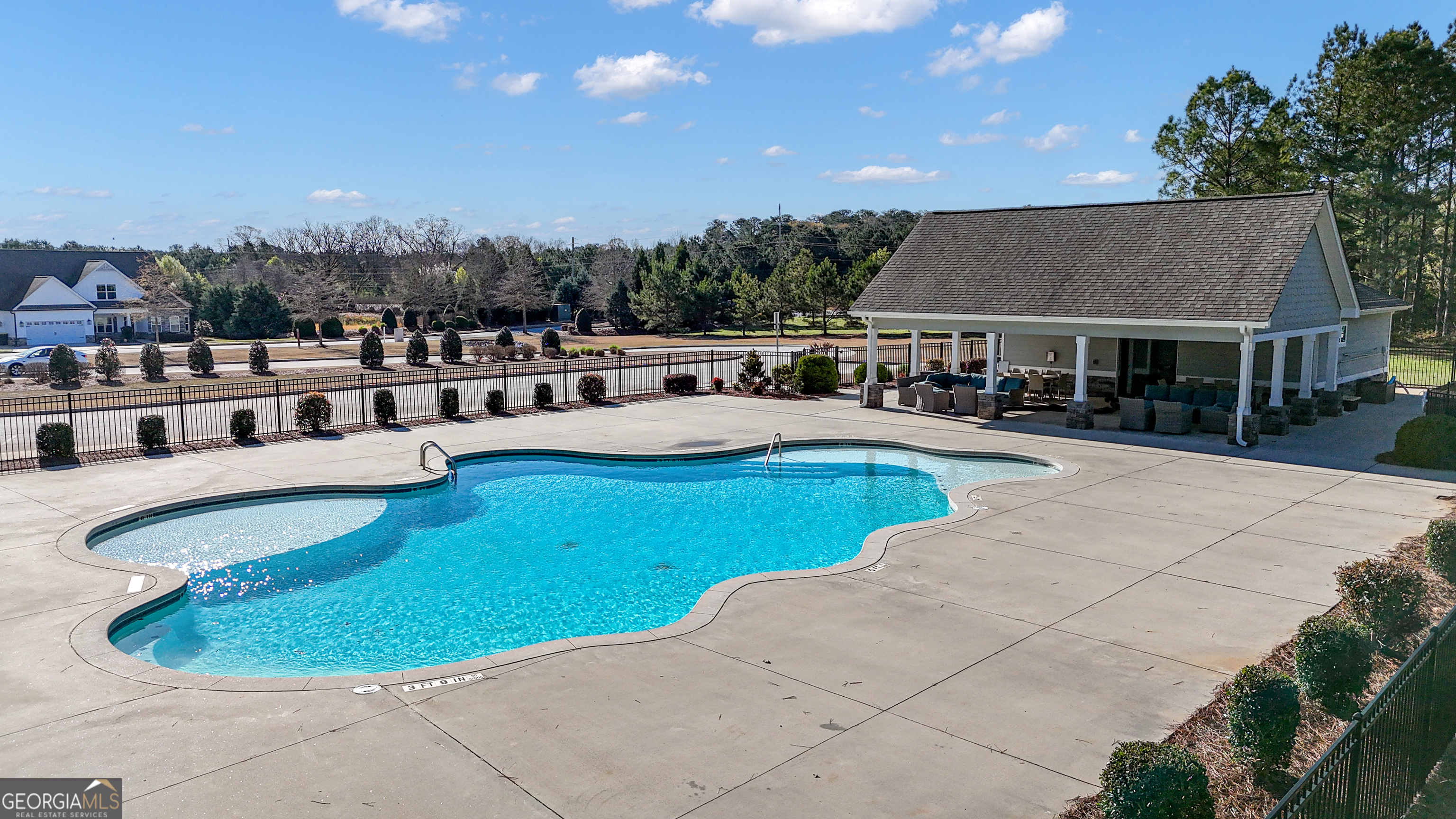 50 Cushing Street Senoia, GA 30276 - Photo 64 of 72 a view of a house with swimming pool and sitting area