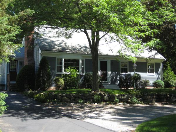108 Boston Post Road Wayland, MA 01778 - Photo 1 of 18 a front view of a house with garden