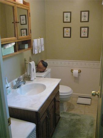 108 Boston Post Road Wayland, MA 01778 - Photo 16 of 18 a bathroom with a sink a toilet and mirror