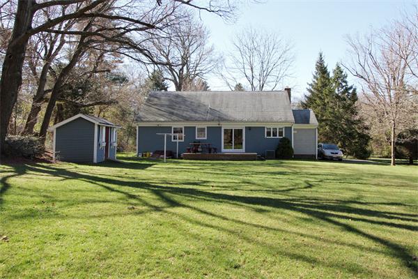 108 Boston Post Road Wayland, MA 01778 - Photo 2 of 18 a front view of a house with a garden