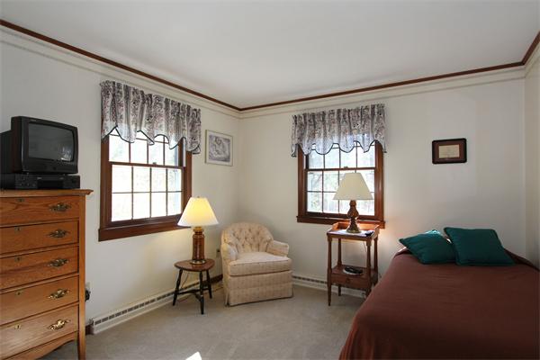 108 Boston Post Road Wayland, MA 01778 - Photo 9 of 18 a bedroom with furniture and a window