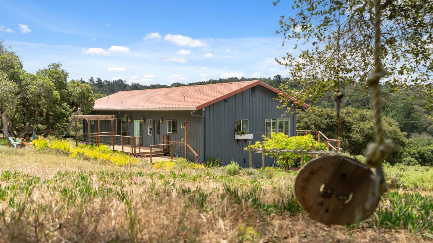 19269 Mallory Canyon Road, Unit D Salinas, CA 93907 - Photo 44 of 77 a front view of house with yard and trees in the background
