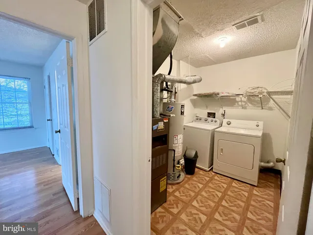 a view of a storage & utility room with washer and dryer