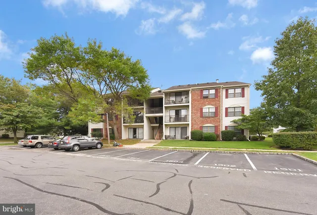 a building with trees in front of it