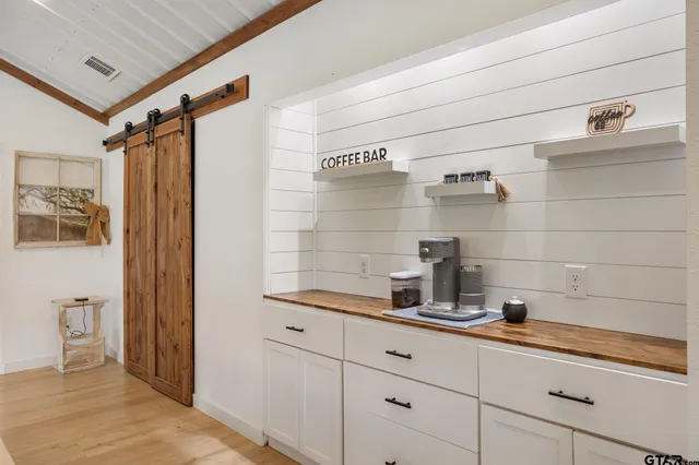 a kitchen with a refrigerator and sink