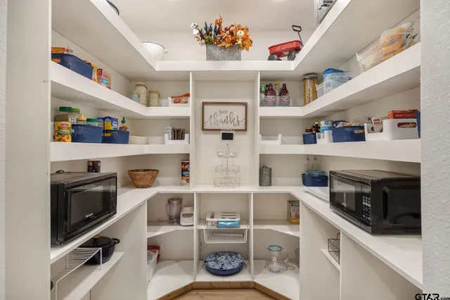 a view of workspace with cabinets