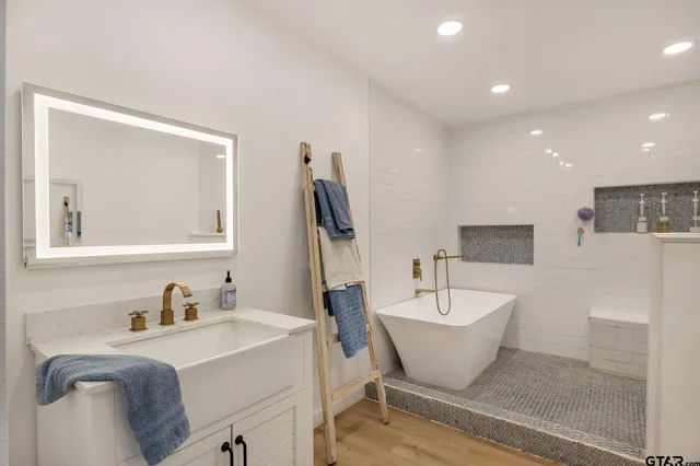 a bathroom with a double vanity sink and a mirror