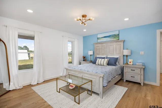 a bedroom with a bed and window