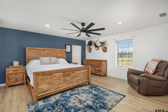 a bedroom with furniture and window