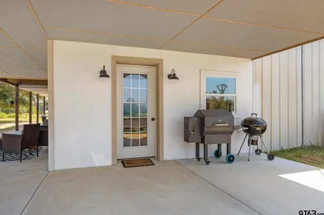 a view of a livingroom with chair and dining area