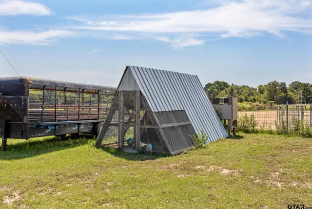 a view of swimming pool with a yard