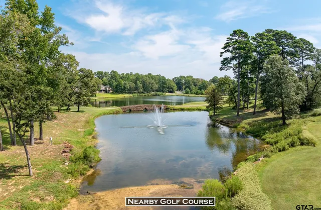 a view of a lake with a yard