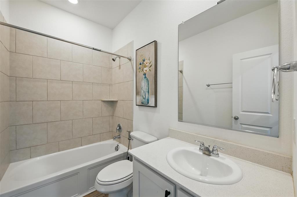 613 Chip Street Little Elm, TX 75068 - Photo 29 of 37 Bathroom featuring bathtub / shower combination and vanity