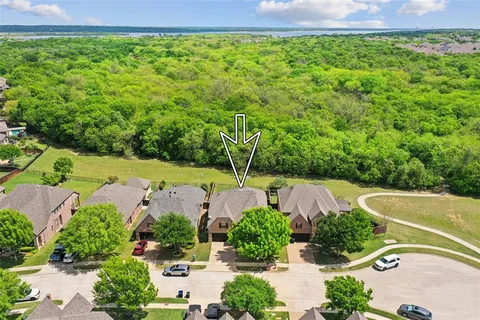 an aerial view of a house with yard