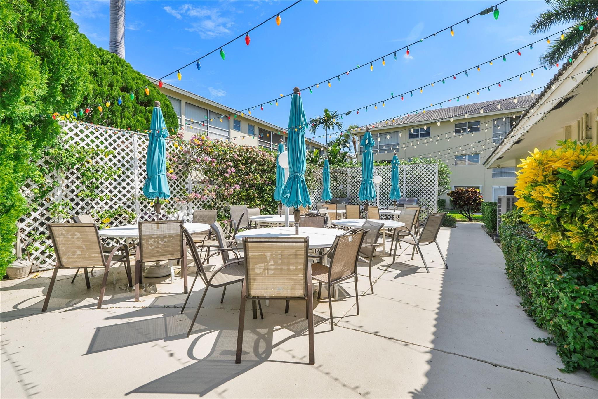 1951 Northeast 39th Street, Unit 156 Lighthouse Point, FL 33064 - Photo 26 of 43 a view of an outdoor dining space with a patio