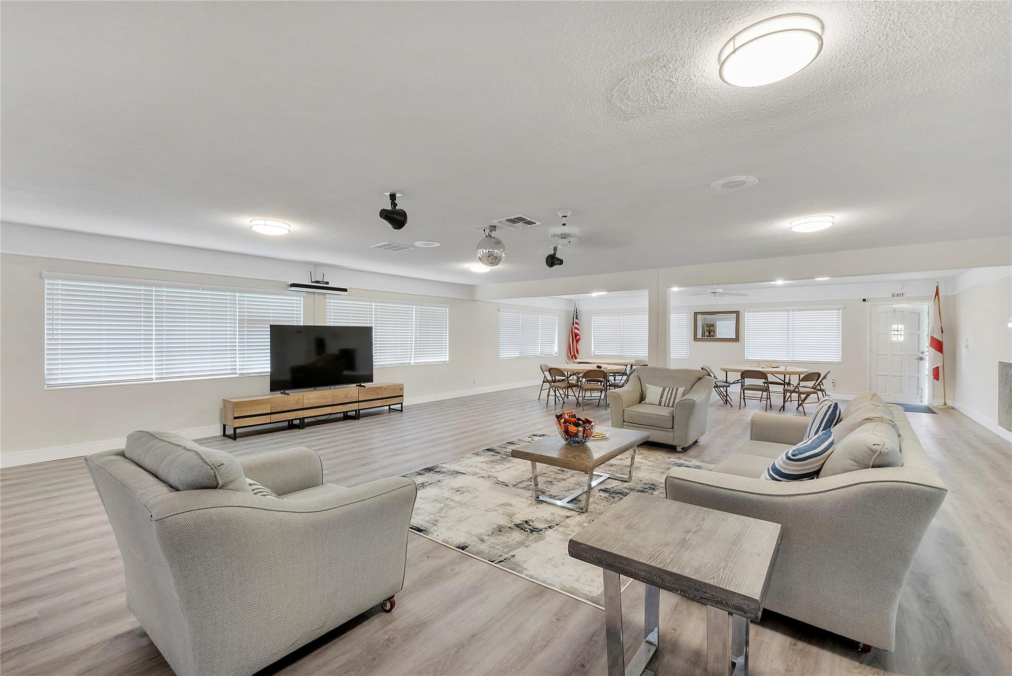 1951 Northeast 39th Street, Unit 156 Lighthouse Point, FL 33064 - Photo 36 of 43 a living room with furniture and a flat screen tv